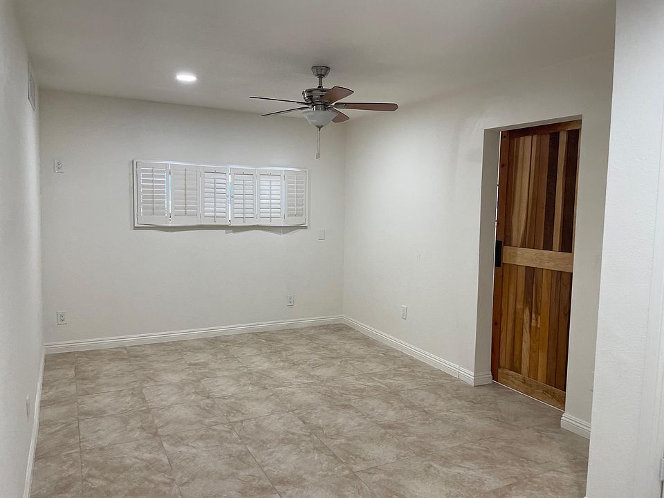 Living Room off of kitchen with door to bedroom