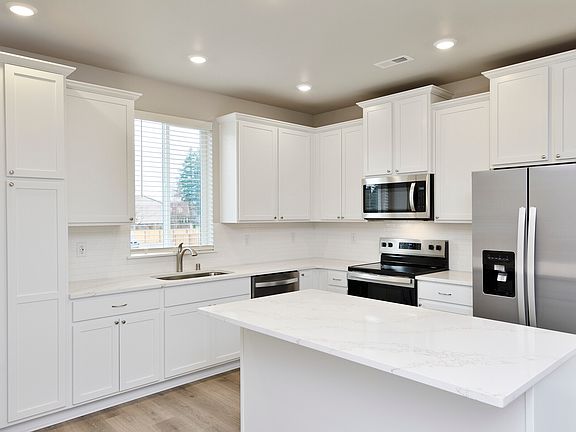 Enjoy Whirlpool stainless steel appliances in your brand-new kitchen.