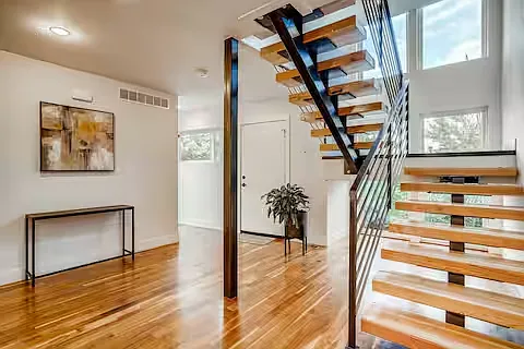 Floating stairs take you up to the second and third floors