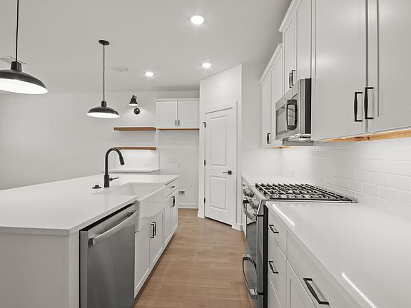Kitchen with white apron-front sink