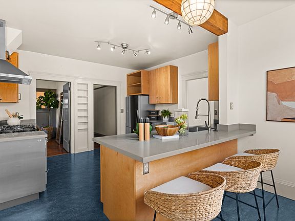 Countertop "peninsula" for barstool dining and easy cleaning