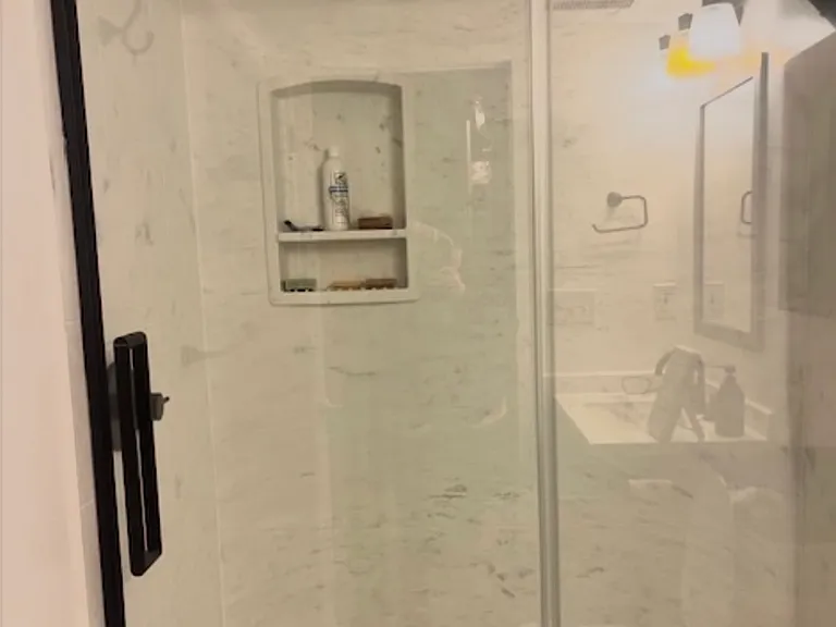 New Swanstone shower system, glass doors and shower head to be installed July 2026 in primary bathroom (ensuite)