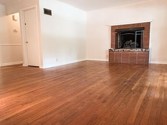 Gorgeous hardwoods in living room, hallways, and main bedrooms, that will be refinished and even more gorgeous prior to move in!