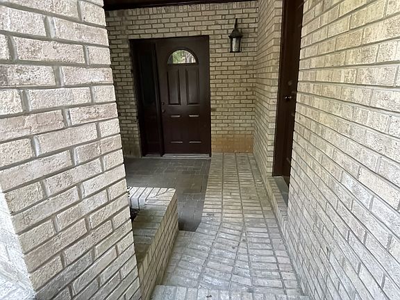 These steps lead to the back door of the apartment building entrance.