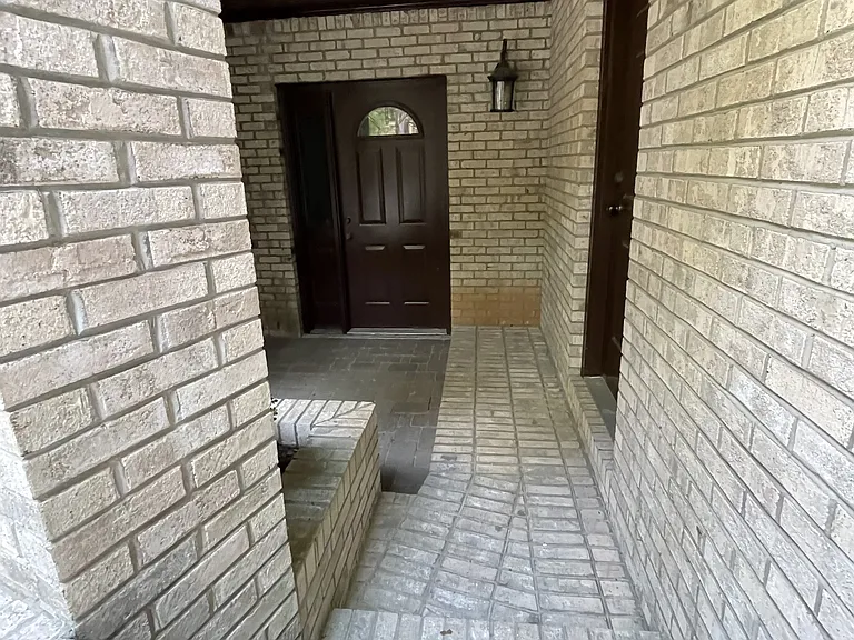 These steps lead to the back door of the apartment building entrance.