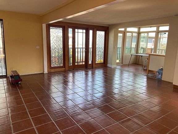 beveled glass wall in living room - tile floors throughout