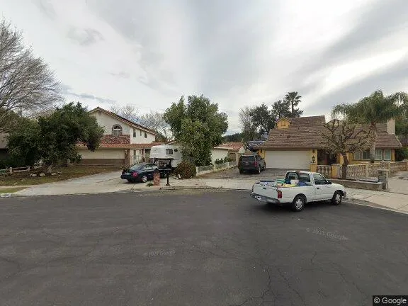 House is yellow with brick work and courtyard - 28110 La Veda Ave