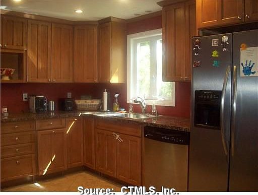 Kitchen has stainless steel and granite