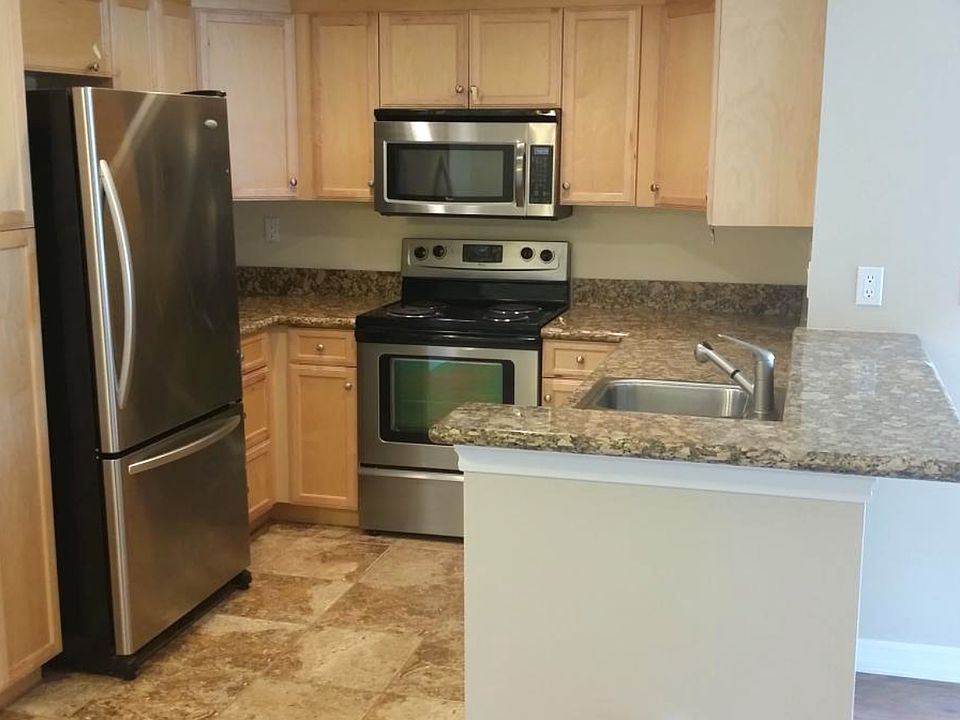 Kitchen with Stainless Steel Appliances and Designer Granite