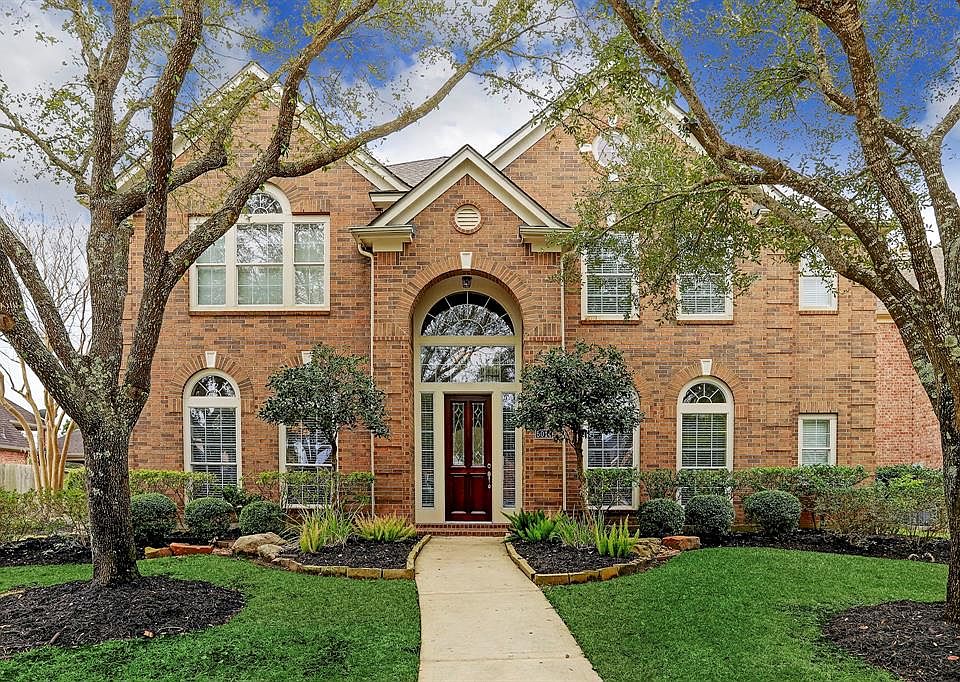 Absolutely immaculate is this stunning 5 bedroom home with 3 car oversized detached garage in the heart of Master Planned Community of Cinco Ranch.
