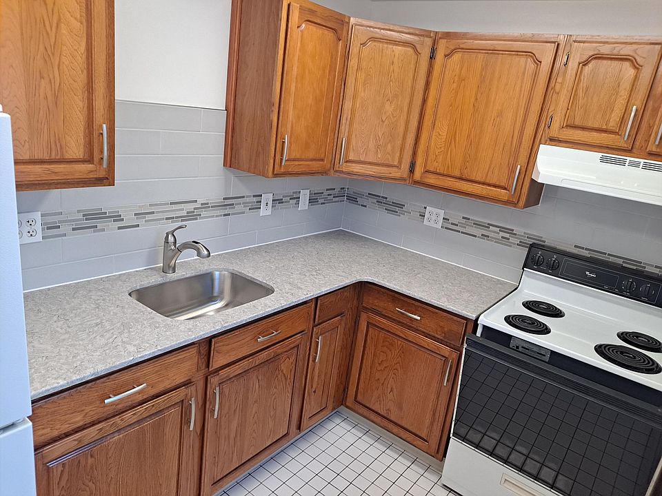 2nd Floor Kitchen Quartz top, hickory cabinets, and tile