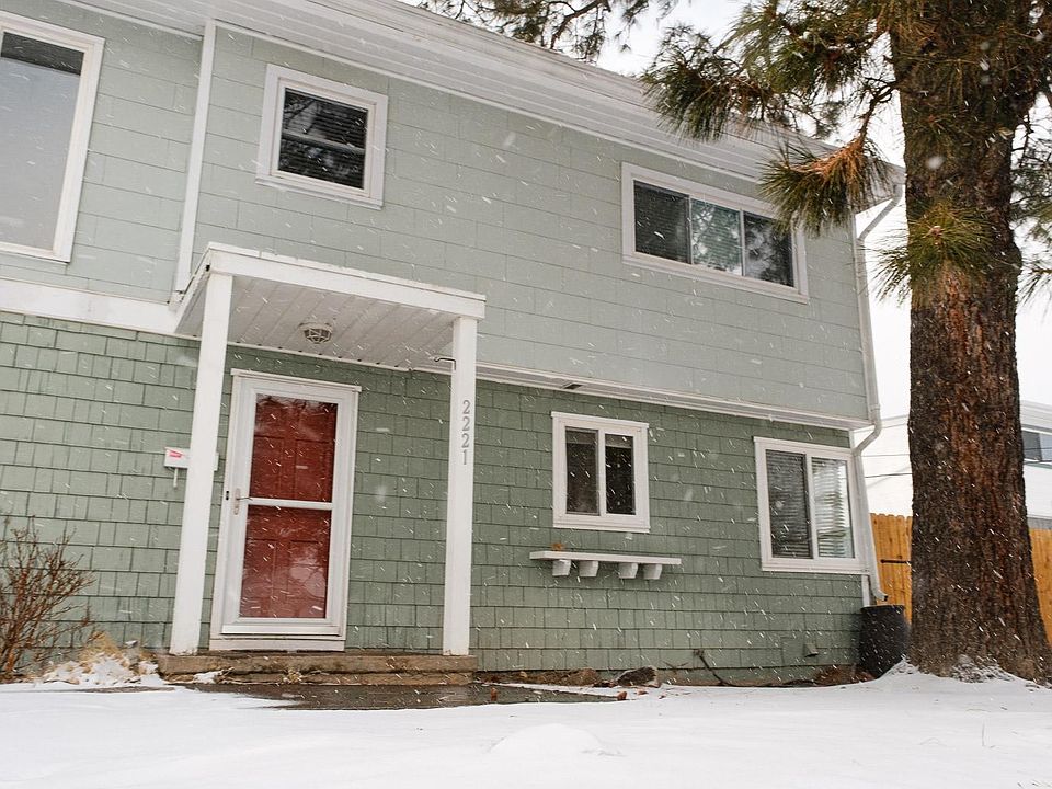 The front of the property has a large pine tree and a terraced front yard. A small covered front porch and shelf for plants under a kitchen window wait for your decorative touches. There is an off street parking spot off the front yard and a gate that l