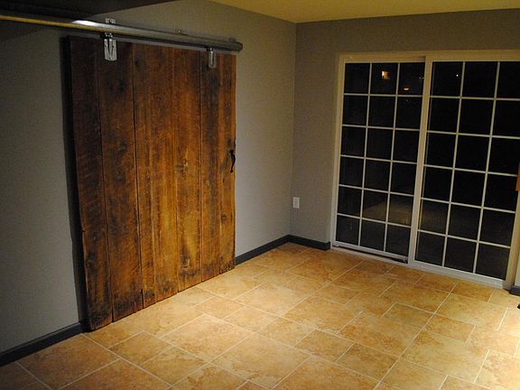 Sliding Reclaimed Barndoor to Storage Area