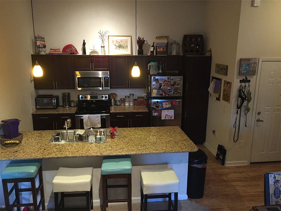 Kitchen with Cathedral Ceilings, granite countertops and sta