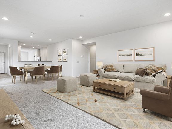 The spacious gathering room is perfect for relaxing after a long day or hosting movie nights with fr