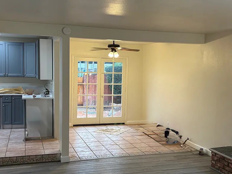 Closer look at the dining room, with the French Doors leading to the backyard. Kitchen entry on the left
