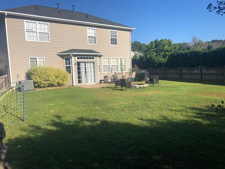 Flat and spacious backyard with fireplace!