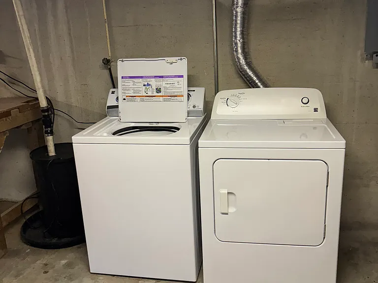 Washer and dryer in basement, stairs to access from within home and outside