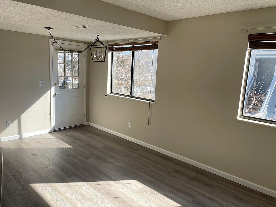 Living and dining area with door to balcony