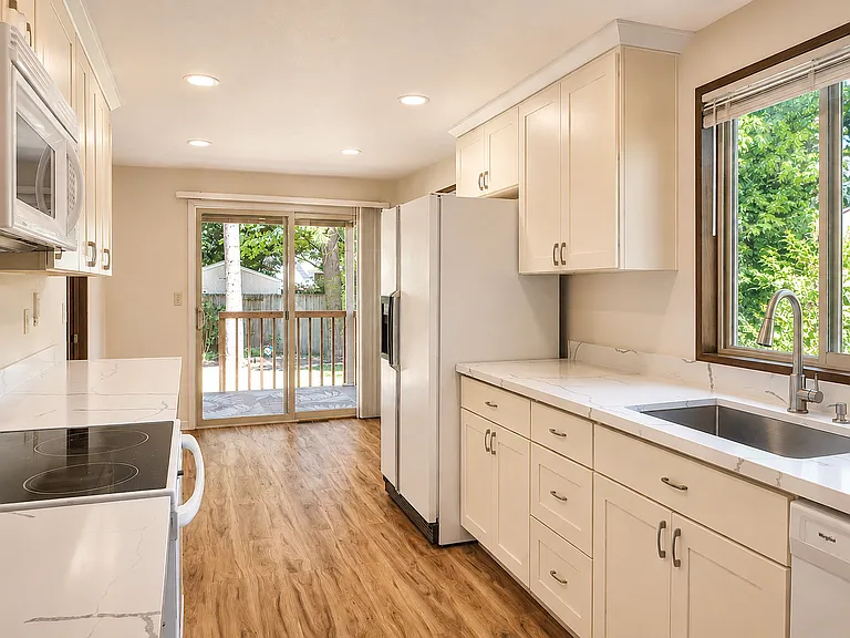 Kitchen and eating area with backyard access
