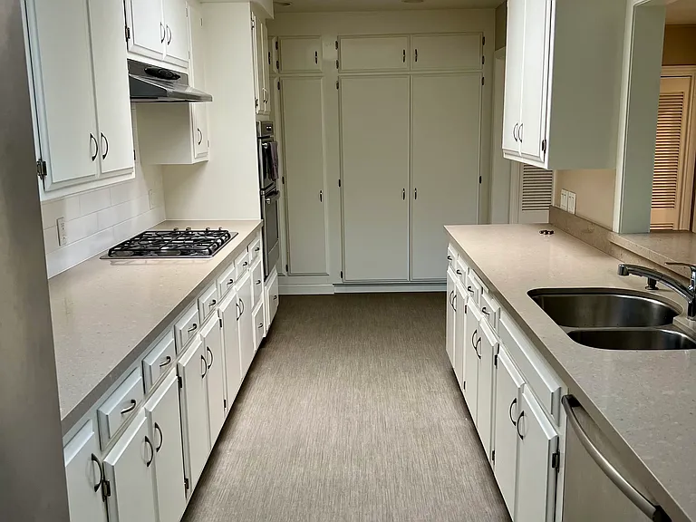 Galley Kitchen with modern appliances and ample storage
