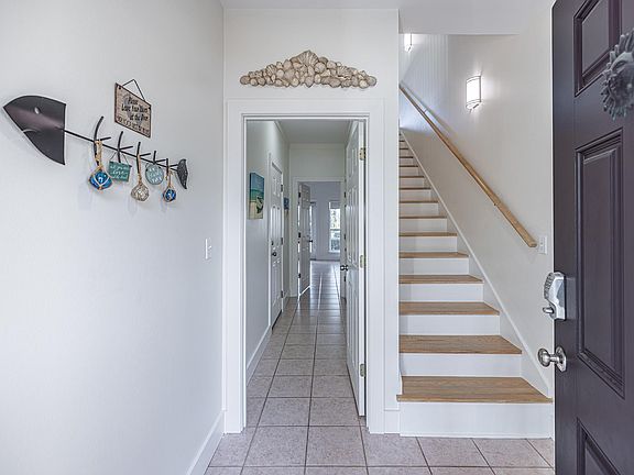 View into front door down 1st floor hallway