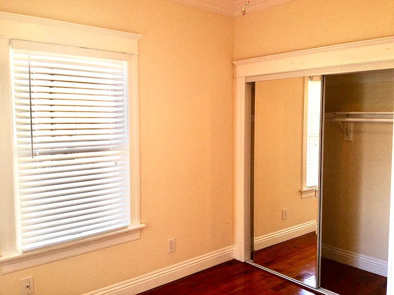Spacious bedroom by USC campus featuring built-in storage - ideal for international scholars