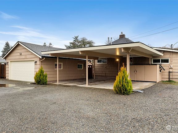 The back side of the home holds a TON of covered and driveway parking for your vehicles & guests! Offering a roomy 2 car garage (480 sq. ft) plus 2 covered carport spaces (676 sq. ft.) PLUS RV parking! The remote controlled overhead garage door was new in 2015>