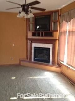 Living
						:
						Fireplace and entertainment built in above. TV stays.