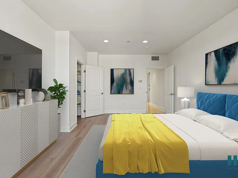 Bedroom with Recessed Lighting, Vinyl Flooring, and Walk-In Closet