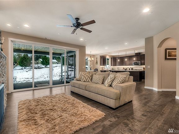 Sought-after open concept living; a generous area accommodates the living room, dining and kitchen. 
