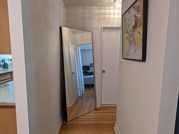 Hallway between living room, bathroom and the bedroom