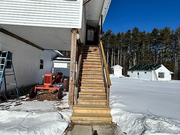 Staircase going to apartment. Stairs are partially covered.