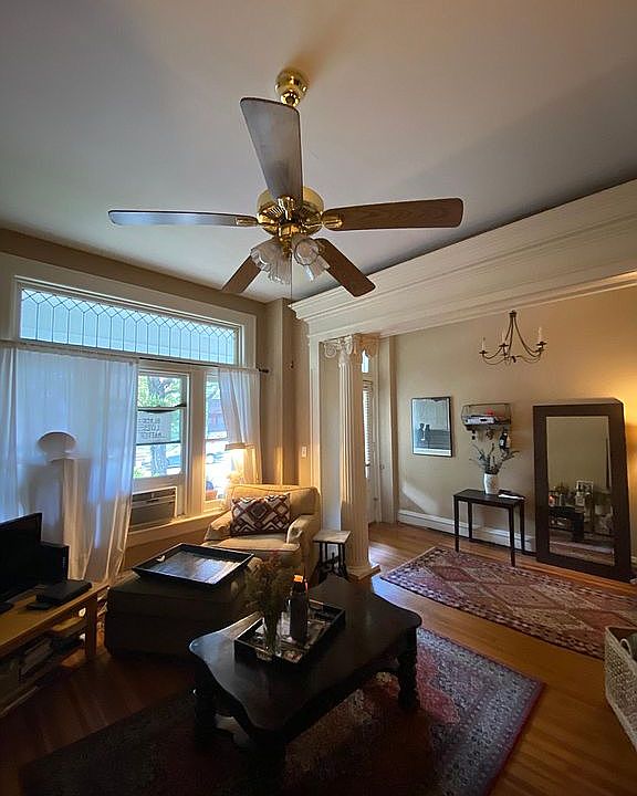 Living room with fluted columns leaded windows