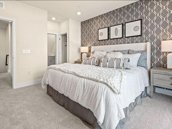 Owner_s Suite A serene retreat, the owner_s suite showcases a comfortable bedroom with direct acess to the deck and a spa-inspired bathroom.