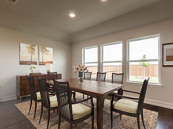 Dining area off kitchen with large windows