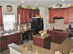 Warm Island Kitchen Creates a Gather Space