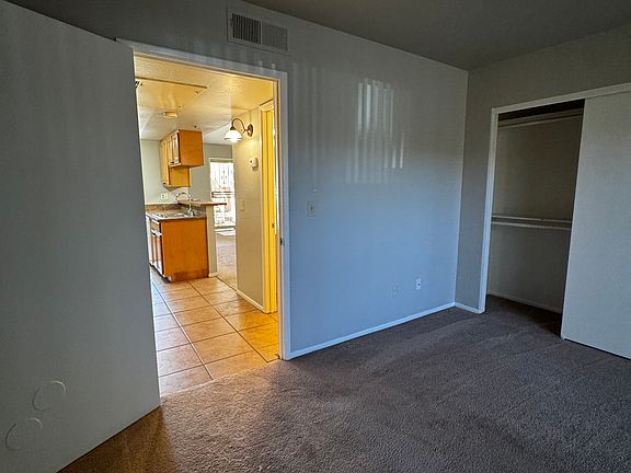 Bedroom going to the kitchen area.