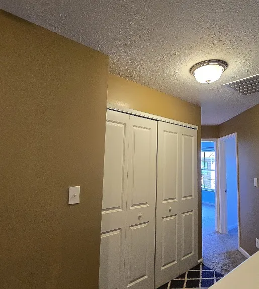 This home features a thoughtfully designed hallway that connects the master bedroom with the guest rooms, creating a private and welcoming bedroom wing.