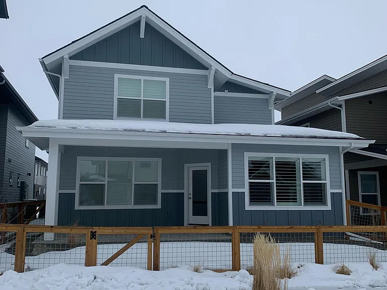 Back of house, covered patio, fenced in backyard