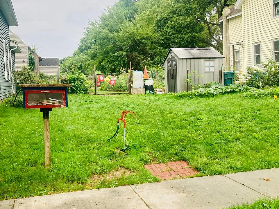 childrens garden with book exchange across the street