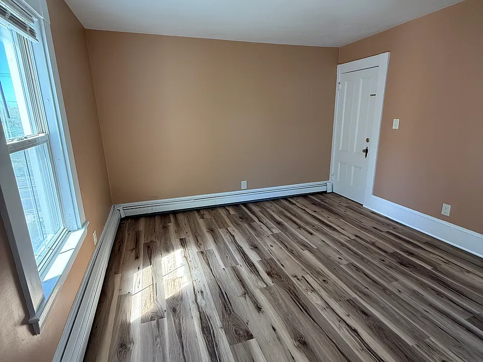Sun filled living room ideally situated between the kitchen and bathroom. Perfect for relaxing and or dedicated office area
