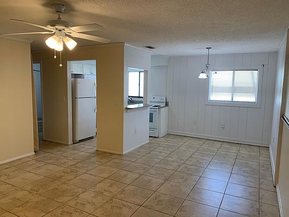 Dining and kitchen areas connected to living area