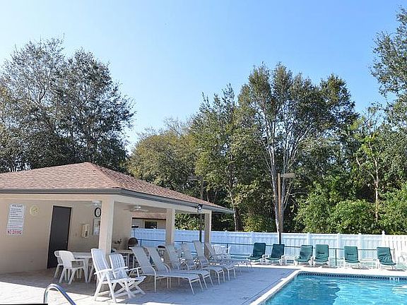Heated swimming pool and shuffle board court