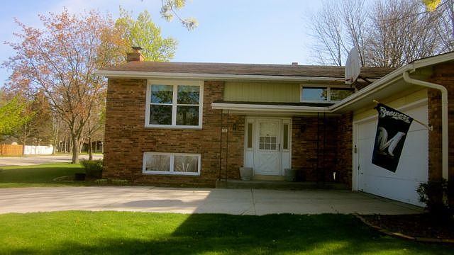 Front with 2 car garage