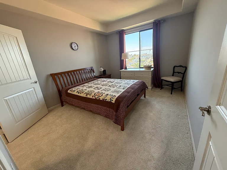 Bedroom with large picture window and a great view over looking about 100 homes. Complete privacy!