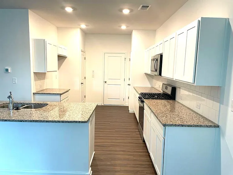 Garage entry and kitchen area