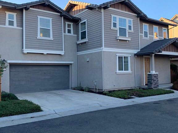 Front view of home + 2 car garage