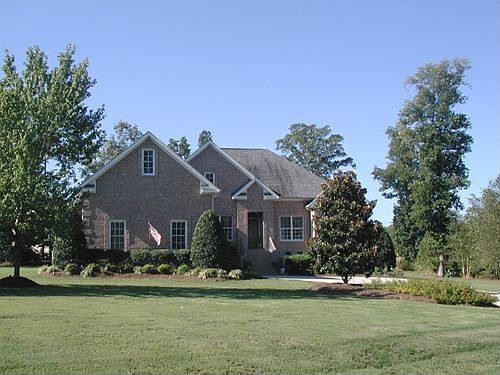Lovely all brick home on landscaped acre lot. 