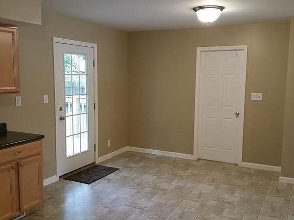 Dining Room
						:
						Door to backyard deck lets in natural light. Door on right is to laundry room.